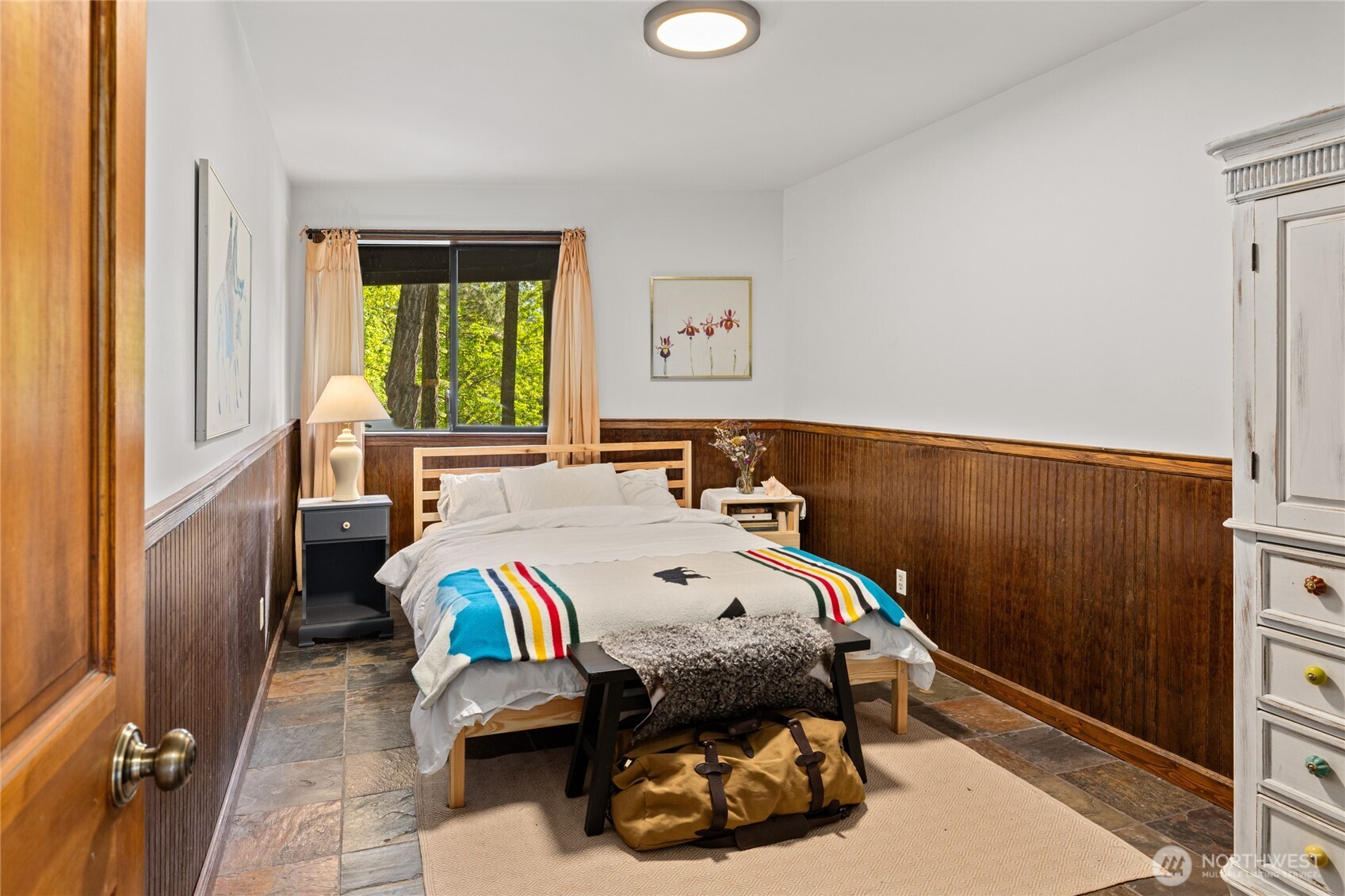 4265 Highway 97 Peshastin, WA 98847 - Photo 24 of 38 a bed sitting in a bedroom next to a window