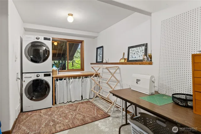 a view of a livingroom with furniture and washing machine