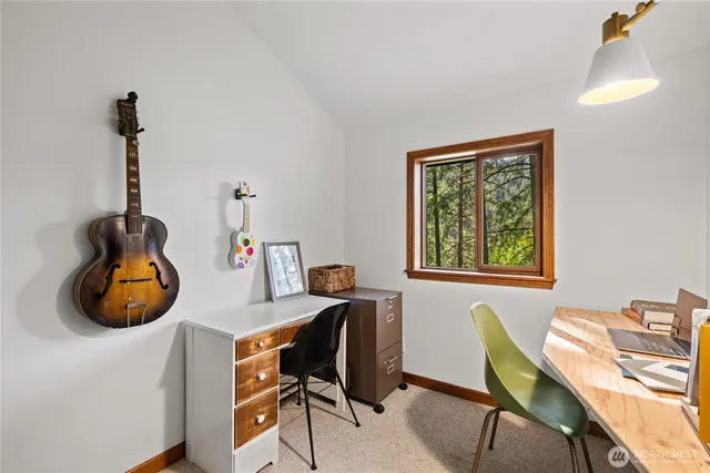 a work room with furniture and a window
