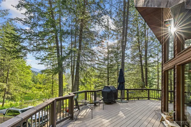 a view of balcony with wooden floor and fence