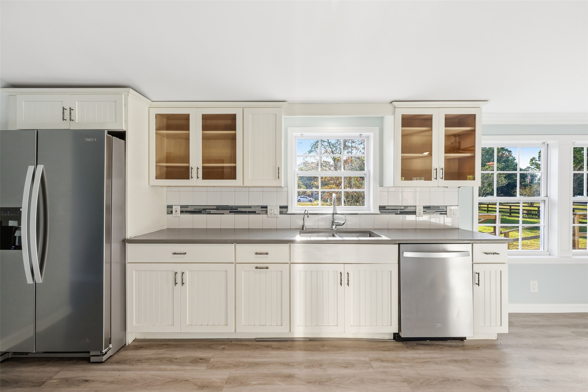 85232 Burmeister Road Fernandina Beach, FL 32034 - Photo 11 of 32 a kitchen with stainless steel appliances granite countertop a sink and a large window
