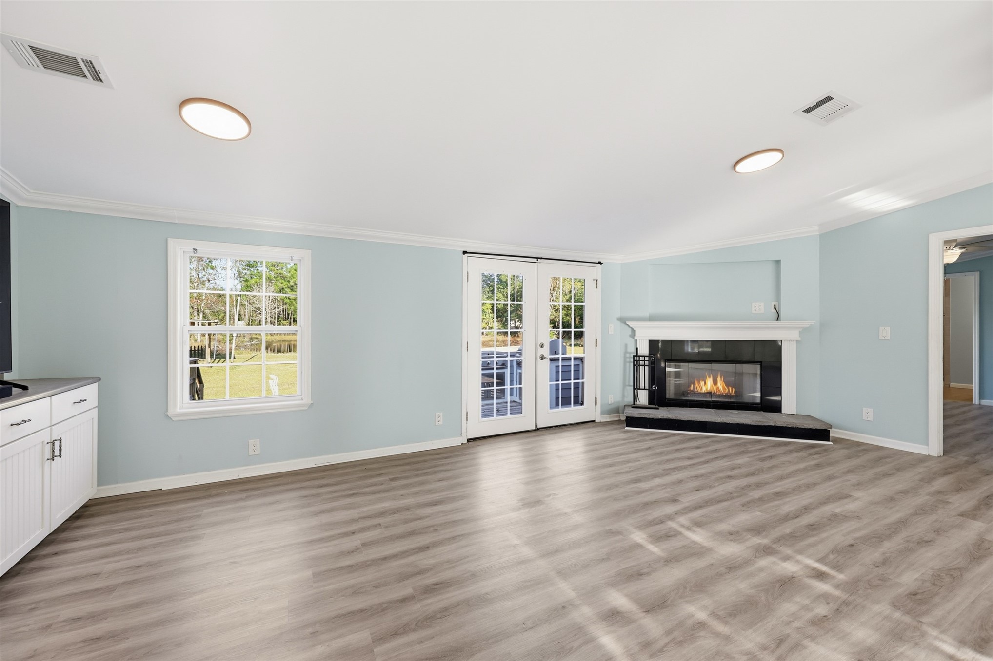 85232 Burmeister Road Fernandina Beach, FL 32034 - Photo 15 of 32 a view of an empty room with a window and fireplace