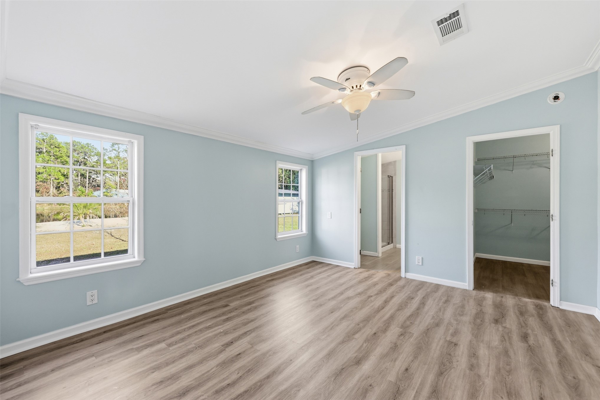 85232 Burmeister Road Fernandina Beach, FL 32034 - Photo 20 of 32 a view of an empty room with window and wooden floor