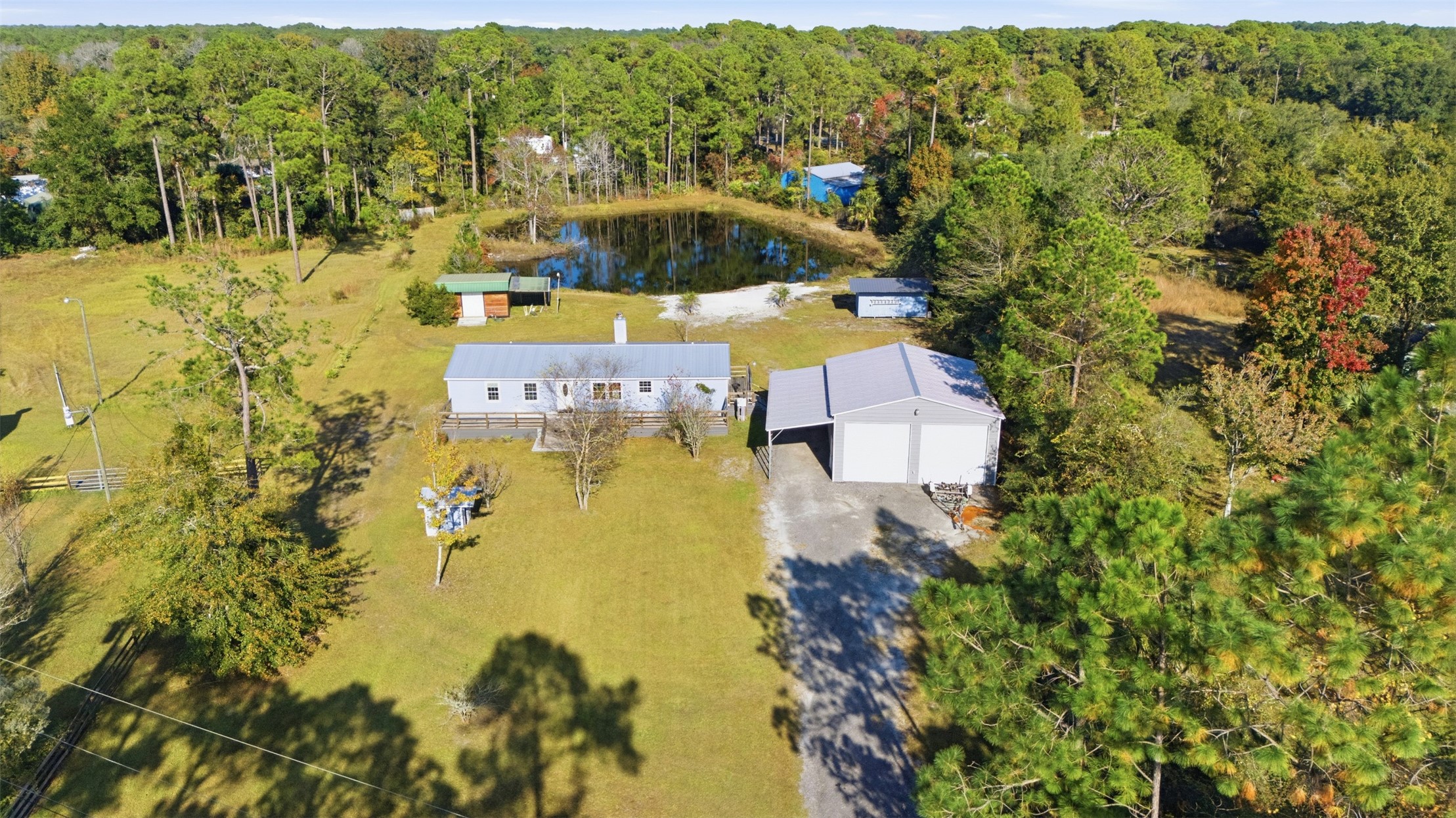 85232 Burmeister Road Fernandina Beach, FL 32034 - Photo 2 of 32 a view of swimming pool with a yard and large trees