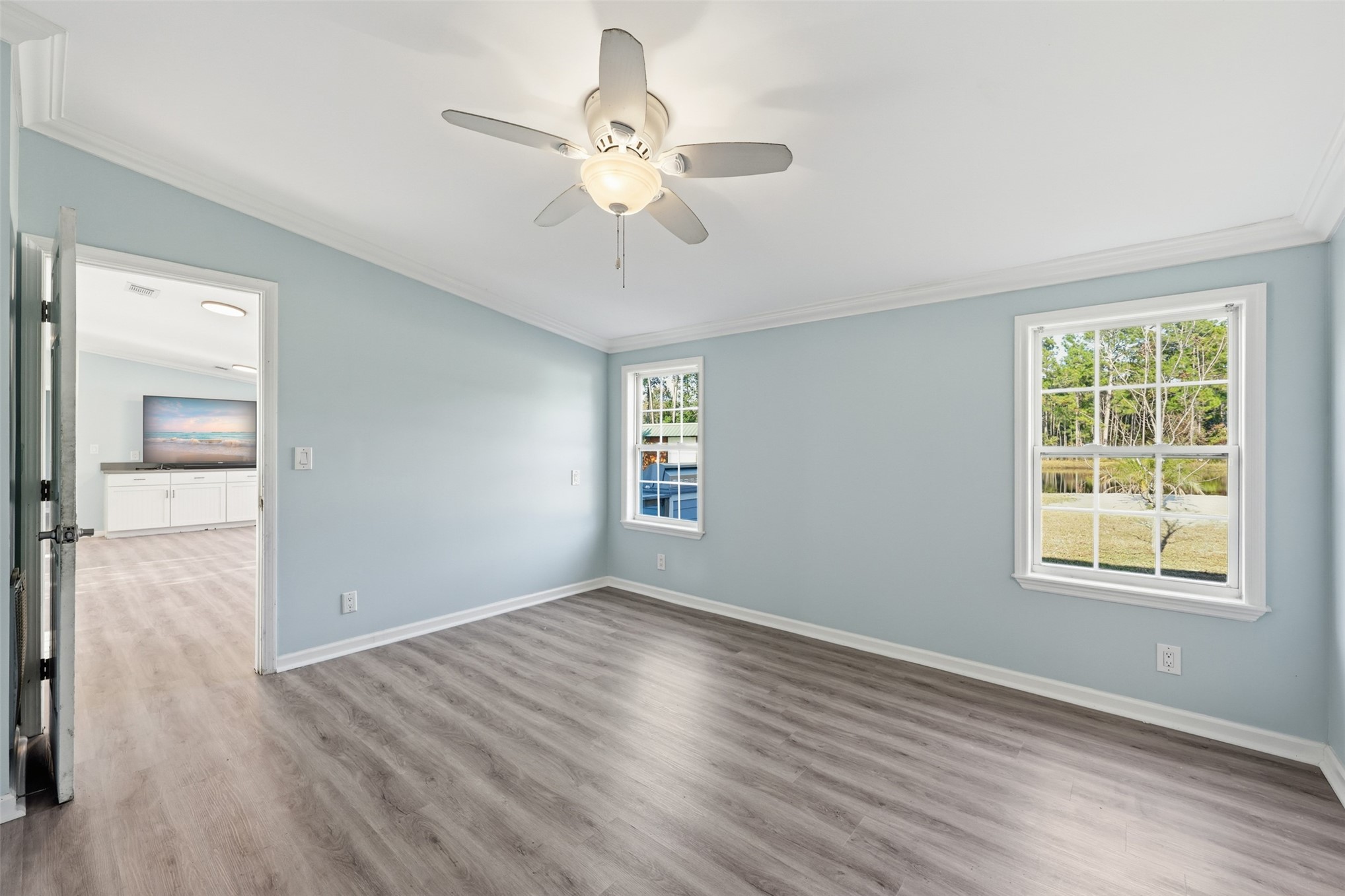 85232 Burmeister Road Fernandina Beach, FL 32034 - Photo 21 of 32 a view of an empty room with wooden floor and a window