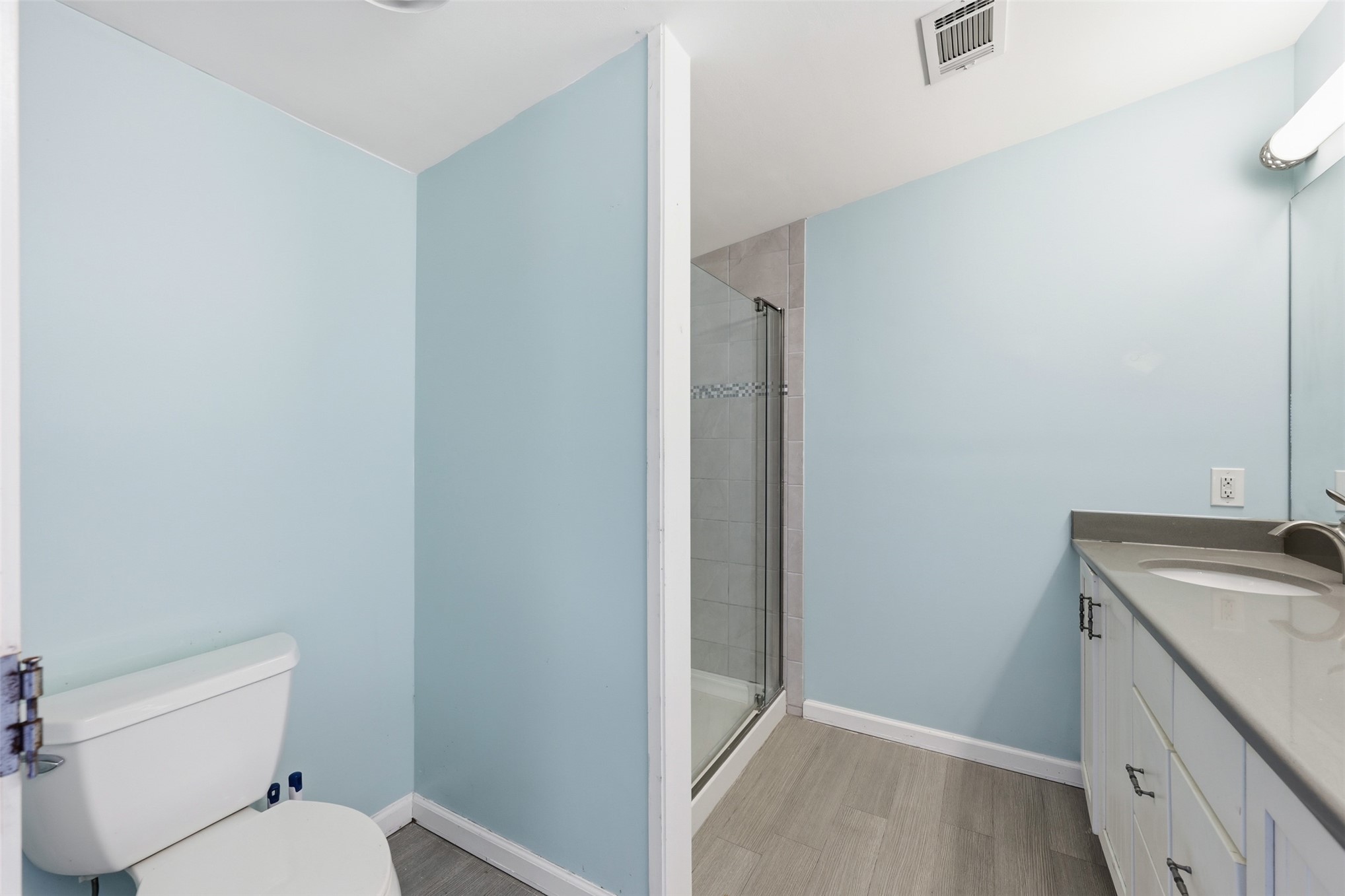 85232 Burmeister Road Fernandina Beach, FL 32034 - Photo 23 of 32 a bathroom with a granite countertop toilet and a sink