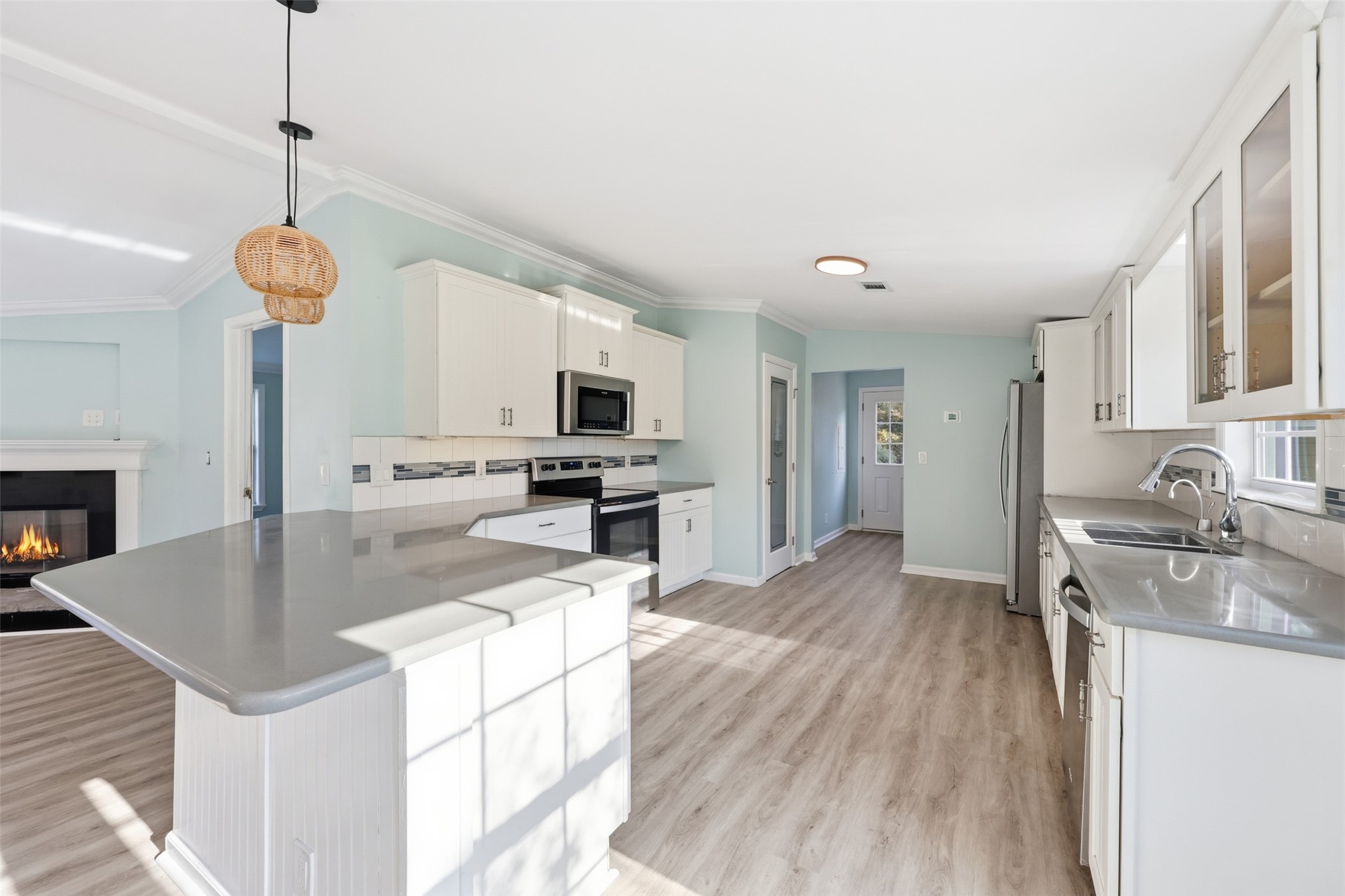 85232 Burmeister Road Fernandina Beach, FL 32034 - Photo 9 of 32 a kitchen with stainless steel appliances granite countertop a sink refrigerator stove and microwave