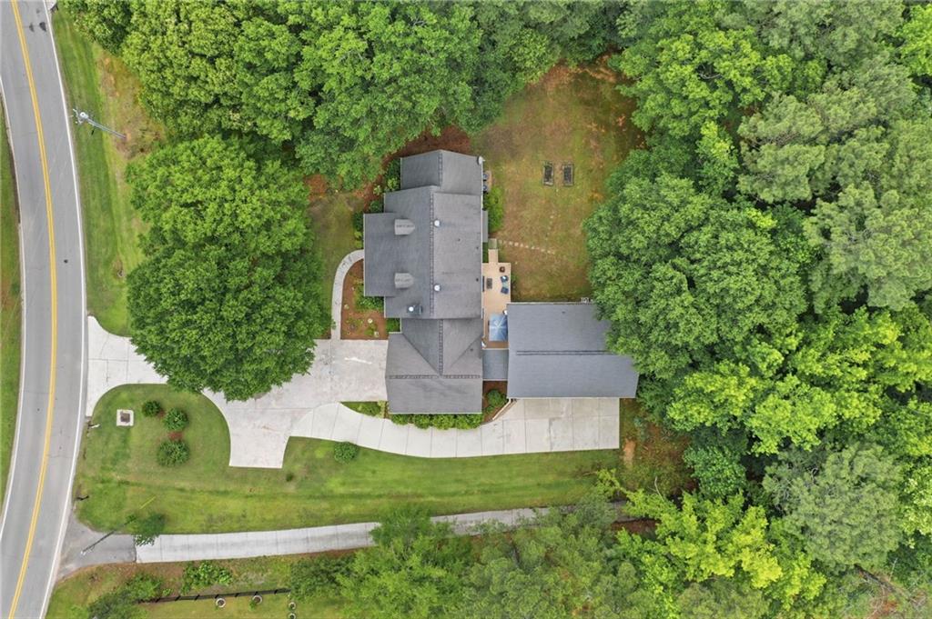 4891 Bill Cheek Road Auburn, GA 30011 - Photo 75 of 99 an aerial view of a house with a yard