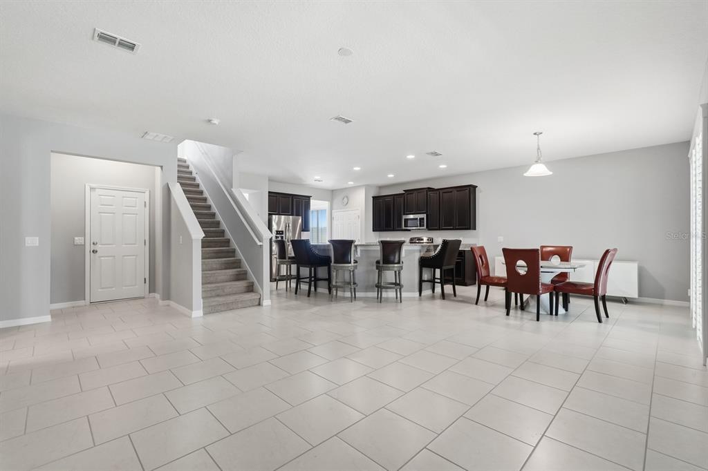 1457 Osprey Ridge Drive Eustis, FL 32736 - Photo 15 of 54 a view of a dining room with furniture