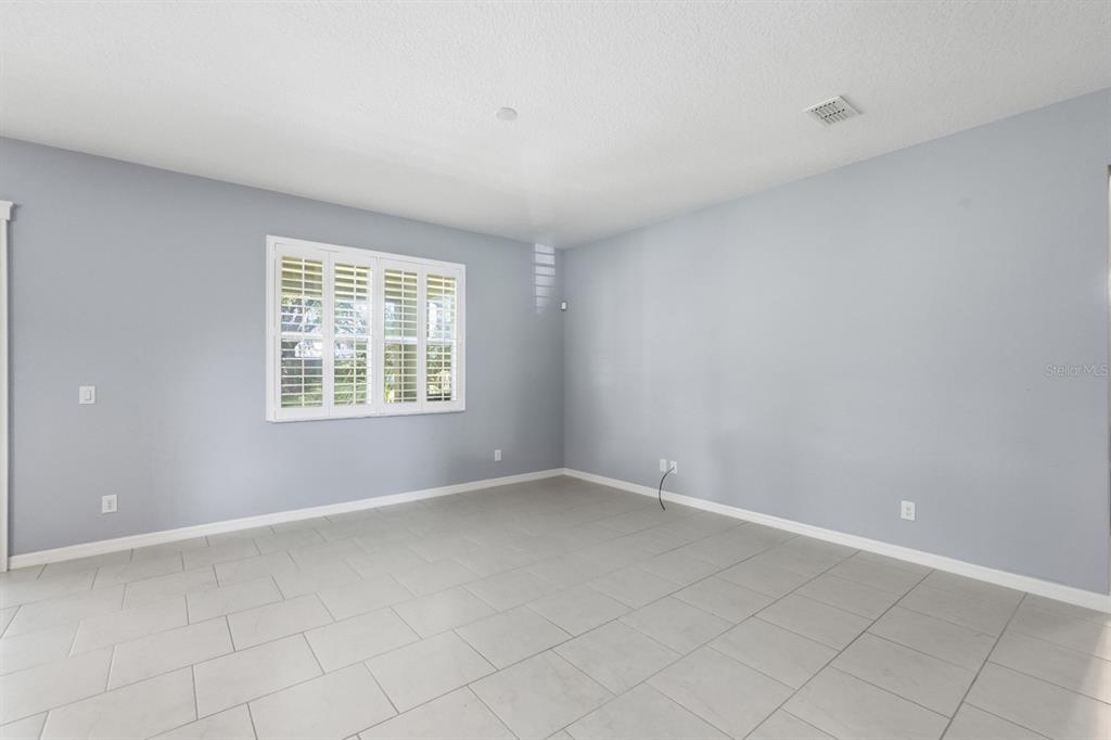 1457 Osprey Ridge Drive Eustis, FL 32736 - Photo 17 of 54 an empty room with windows