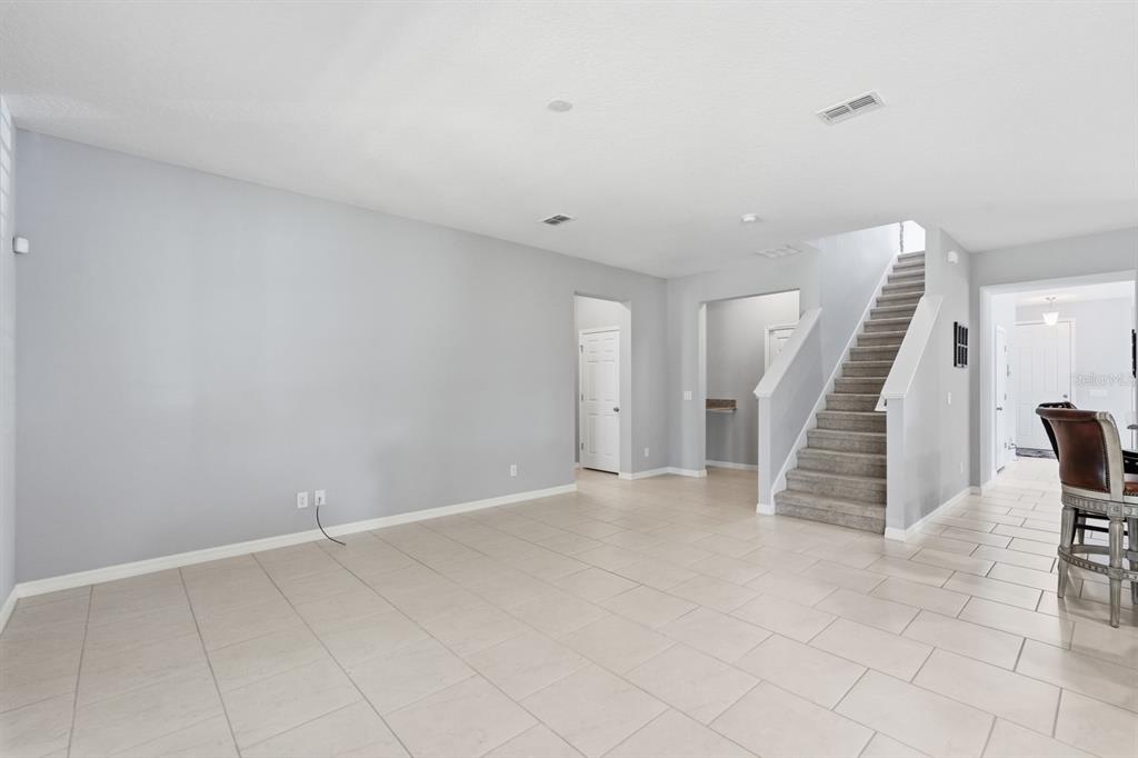 1457 Osprey Ridge Drive Eustis, FL 32736 - Photo 18 of 54 a view of an empty room with stairs