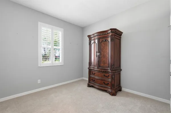 a view of a livingroom with furniture and stairs