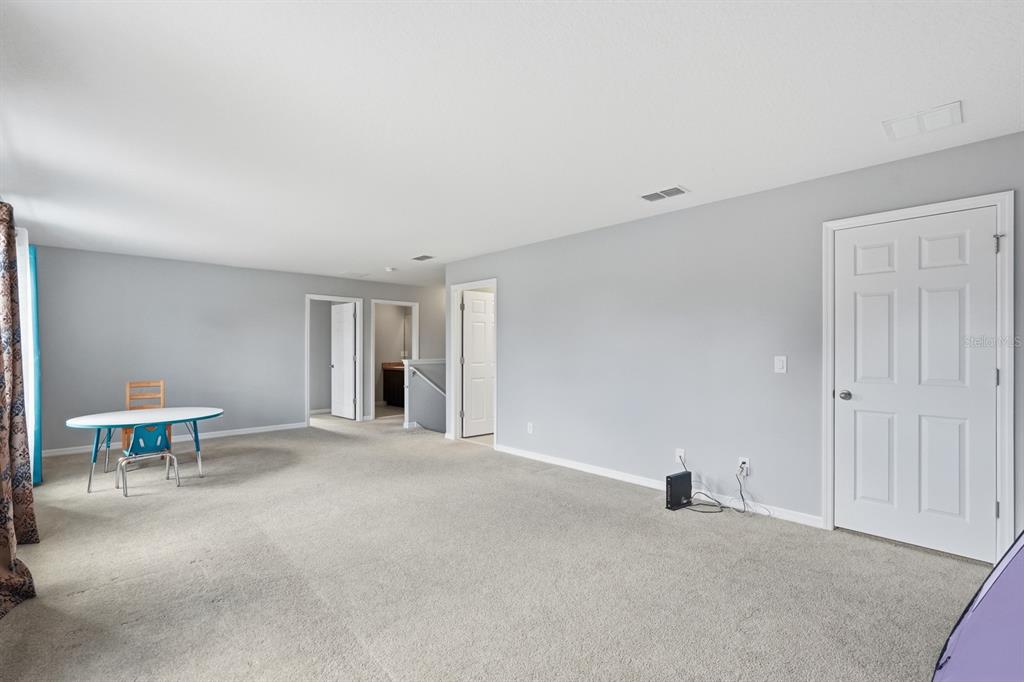 1457 Osprey Ridge Drive Eustis, FL 32736 - Photo 24 of 54 a view of a livingroom with furniture and a window