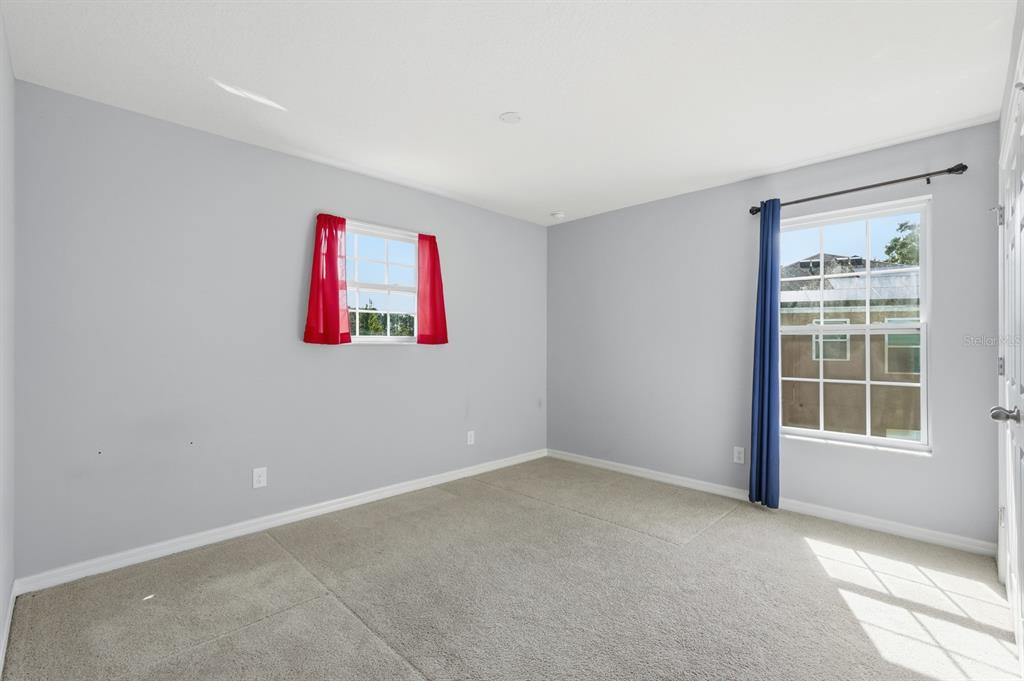 1457 Osprey Ridge Drive Eustis, FL 32736 - Photo 27 of 54 an empty room with a window