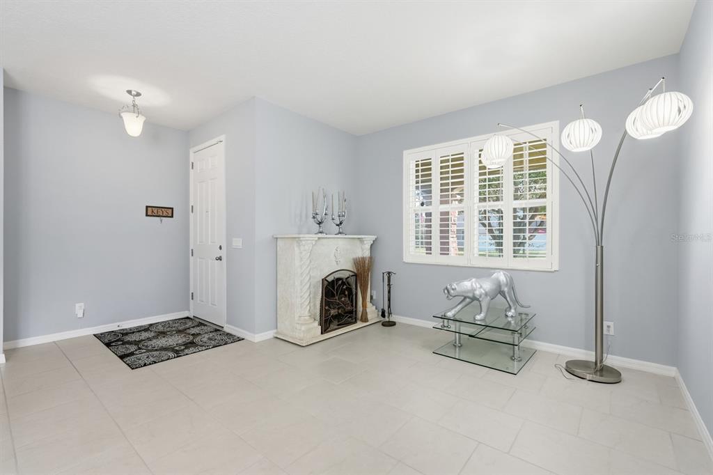 1457 Osprey Ridge Drive Eustis, FL 32736 - Photo 3 of 54 a living room with furniture and a fireplace