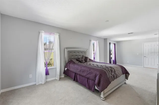 a bathroom with double sink and a mirror