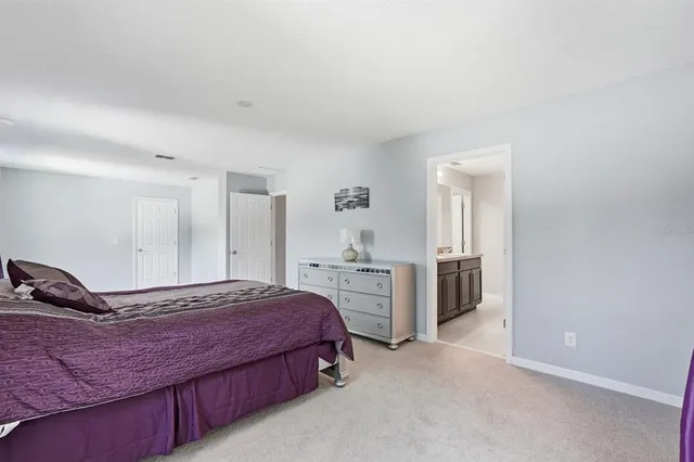 a spacious bathroom with a bathtub and shower