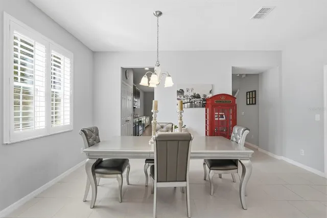a dining room with furniture and window