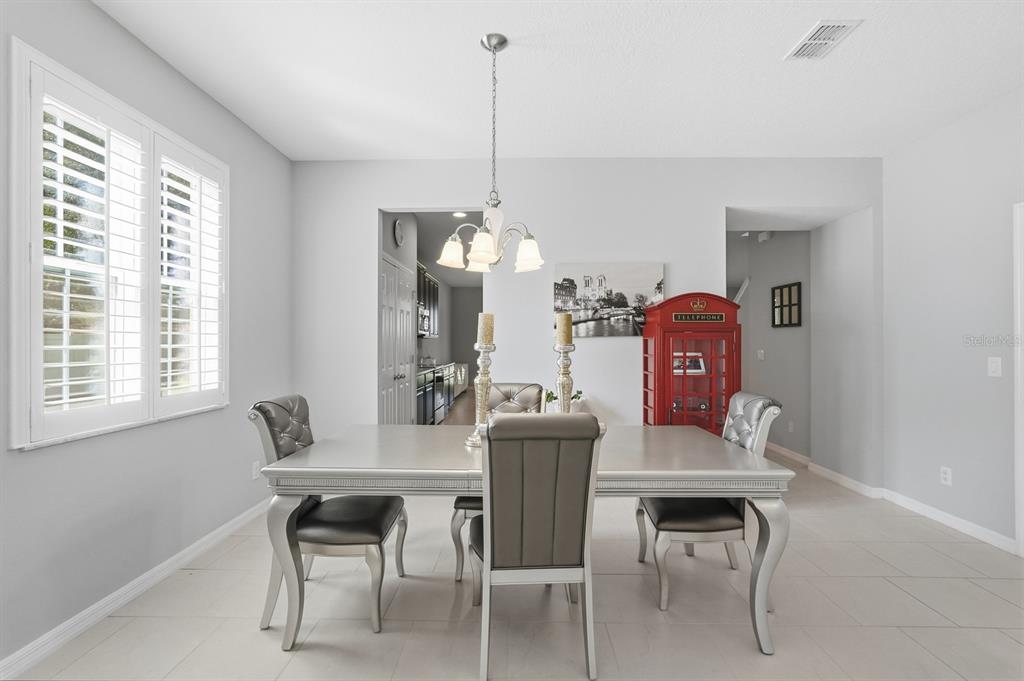 1457 Osprey Ridge Drive Eustis, FL 32736 - Photo 4 of 54 a dining room with furniture and window