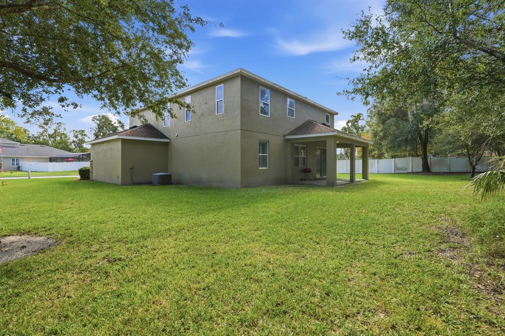 1457 Osprey Ridge Drive Eustis, FL 32736 - Photo 49 of 54 a front view of house with yard and green space