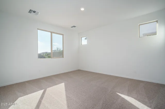 an empty room with white walls and white walls