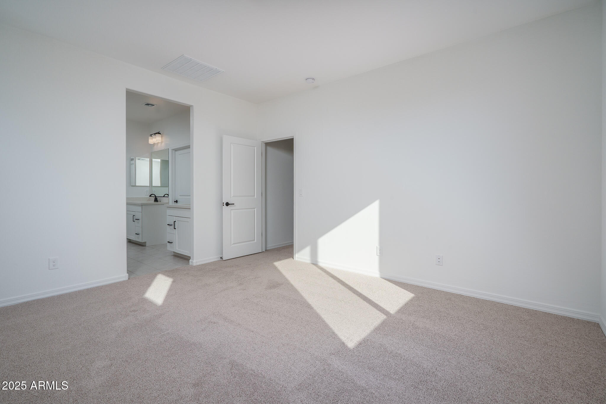 20607 West Rancho Drive Buckeye, AZ 85396 - Photo 13 of 32 an empty room with white walls and white walls