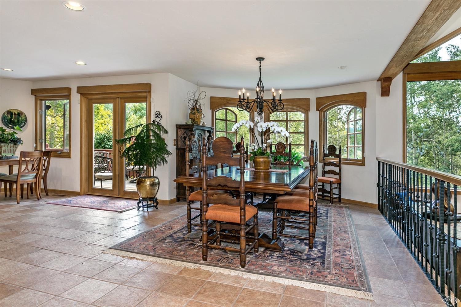 781 Potato Patch Drive Vail, CO 81657 - Photo 12 of 39 a view of a dining room with furniture window and outside view