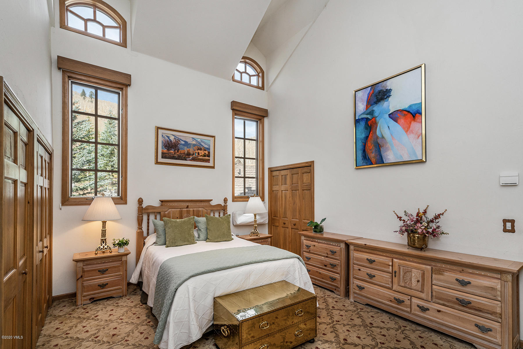 781 Potato Patch Drive Vail, CO 81657 - Photo 16 of 39 a bedroom with a bed and a chandelier