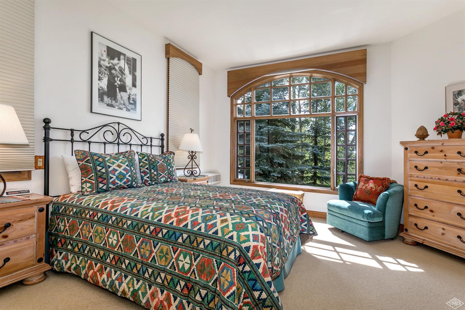 781 Potato Patch Drive Vail, CO 81657 - Photo 19 of 39 a bedroom with a bed dresser and a window