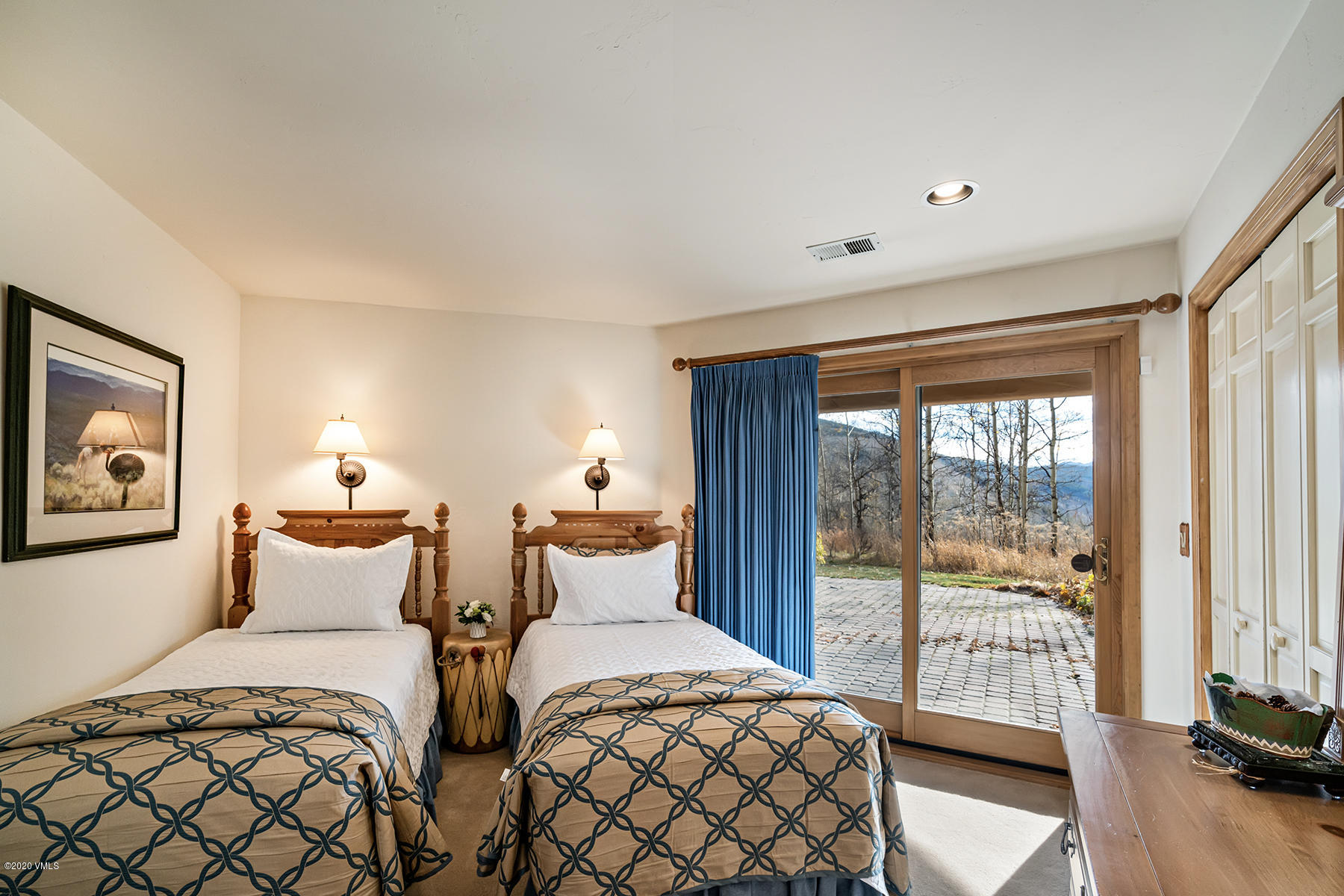 781 Potato Patch Drive Vail, CO 81657 - Photo 21 of 39 a bedroom with two beds and a large window