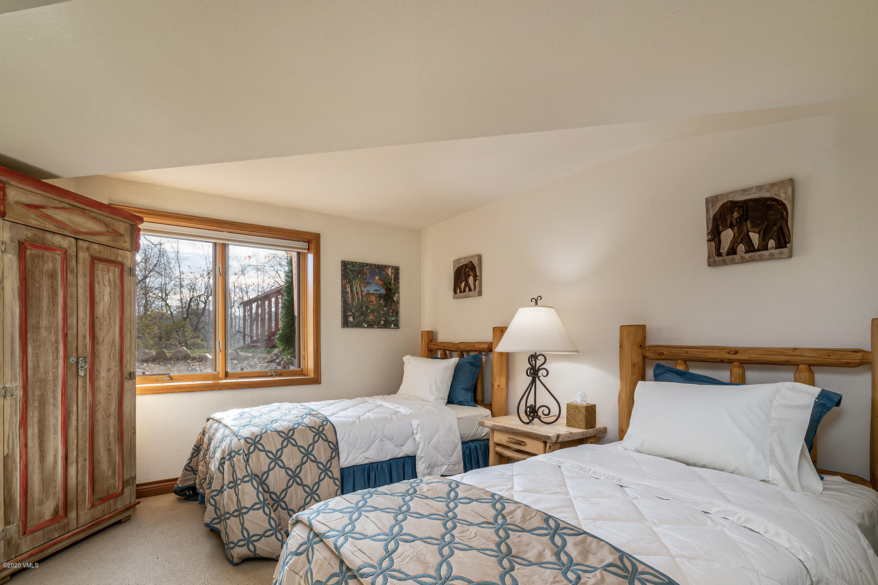 781 Potato Patch Drive Vail, CO 81657 - Photo 22 of 39 a bedroom with two beds and a large window