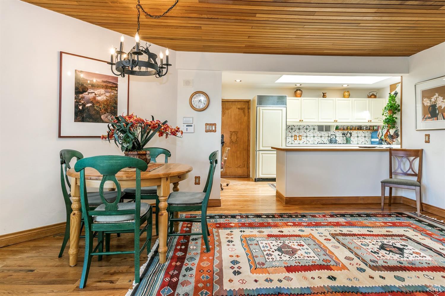 781 Potato Patch Drive Vail, CO 81657 - Photo 34 of 39 a view of a dining room with furniture and a chandelier