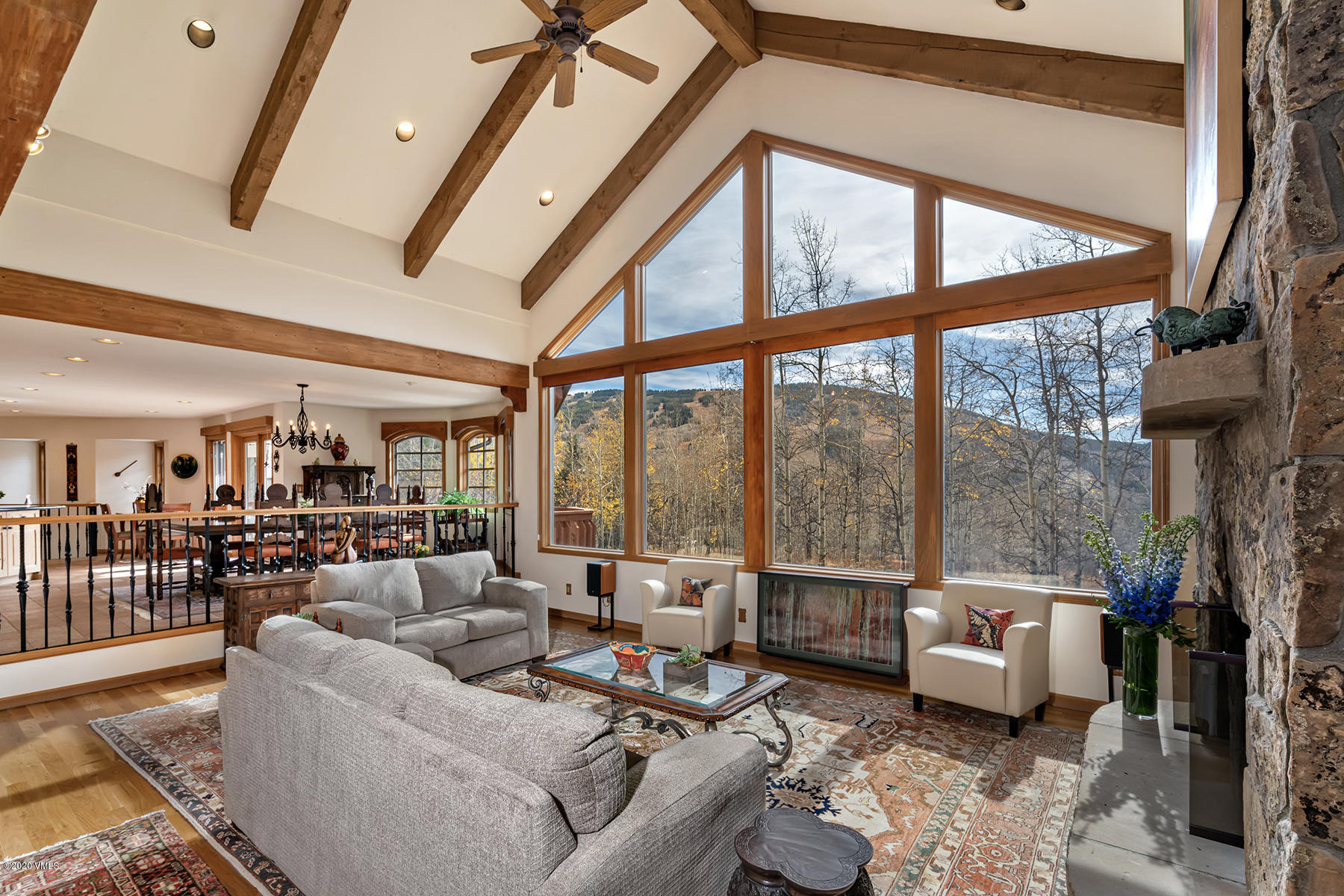781 Potato Patch Drive Vail, CO 81657 - Photo 6 of 39 a living room with furniture and a floor to ceiling window