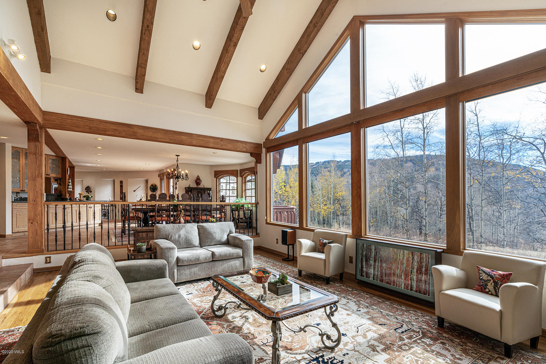 781 Potato Patch Drive Vail, CO 81657 - Photo 7 of 39 a living room with furniture and a floor to ceiling window