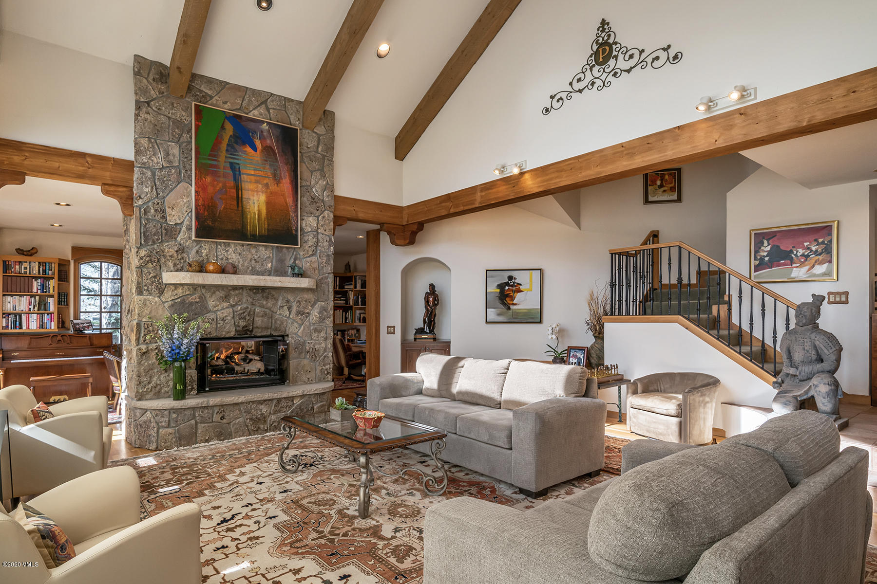 781 Potato Patch Drive Vail, CO 81657 - Photo 8 of 39 a living room with furniture fireplace and rug