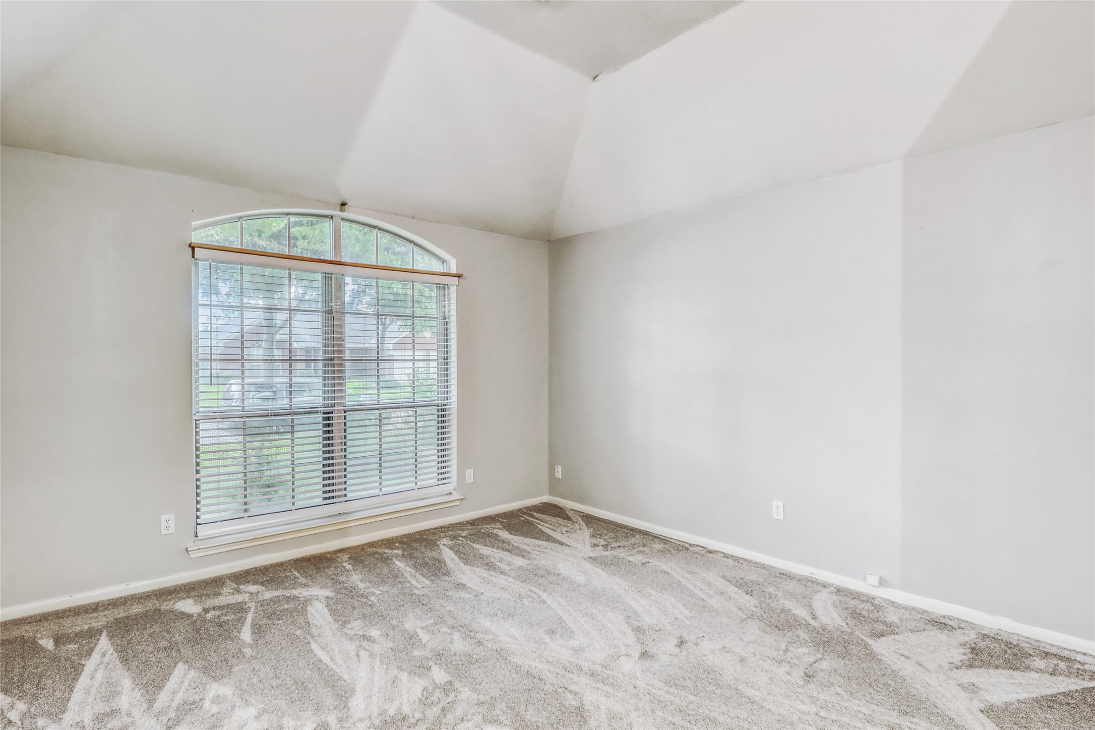 7215 Pembrough Lane Katy, TX 77494 - Photo 4 of 20 an empty room with windows