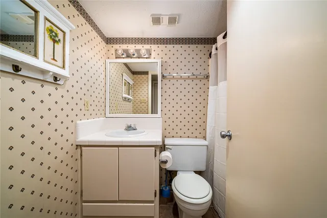 a view of a balcony with chairs