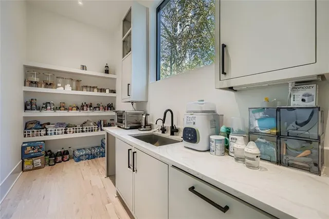 a kitchen with stainless steel appliances a sink and cabinets