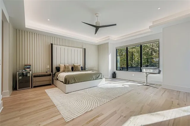 a bedroom with a large bed and a window