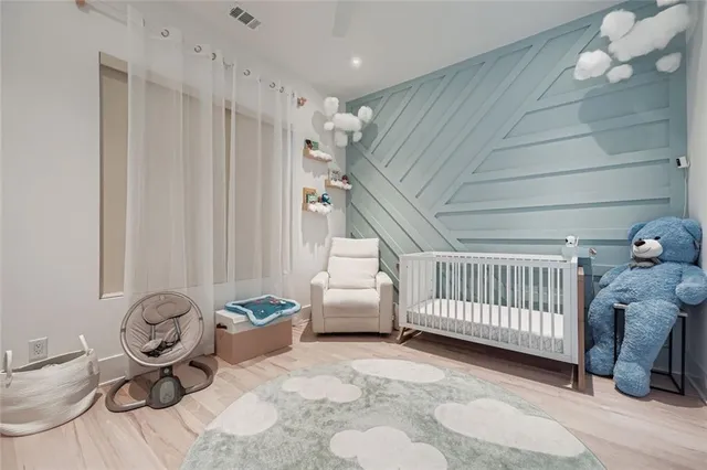 a bedroom with furniture and a window