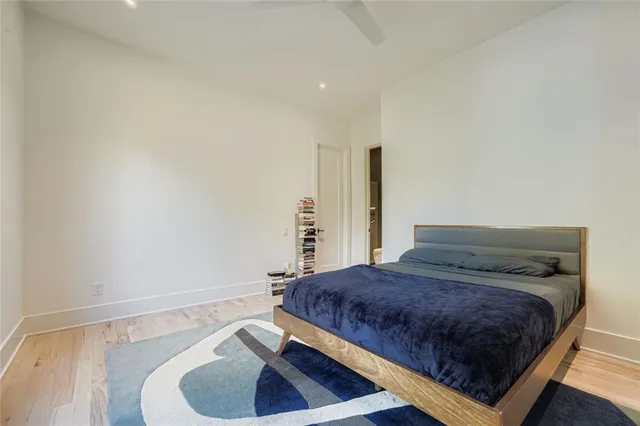 a bedroom with a bed and a couch