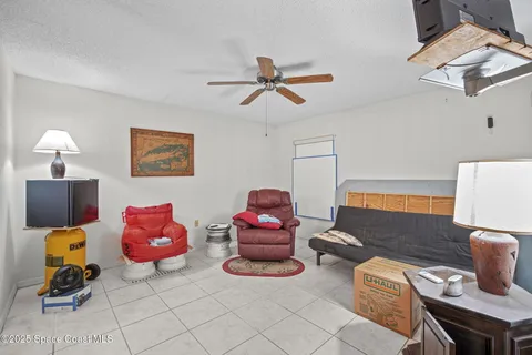 a room with pool table and windows