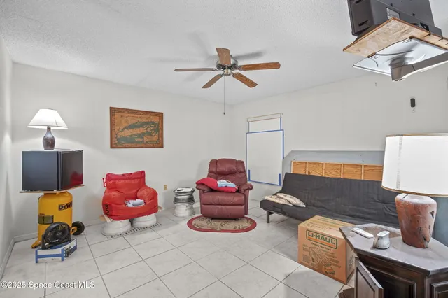 a room with pool table and windows