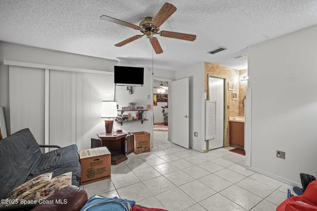 a living room with furniture and a lamp