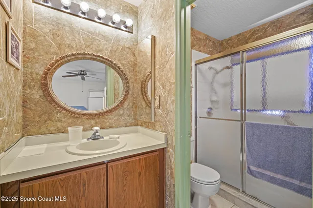 a living room with furniture a flat screen tv and a window