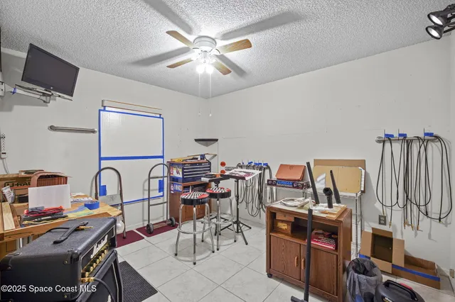 a room with furniture and musical instruments