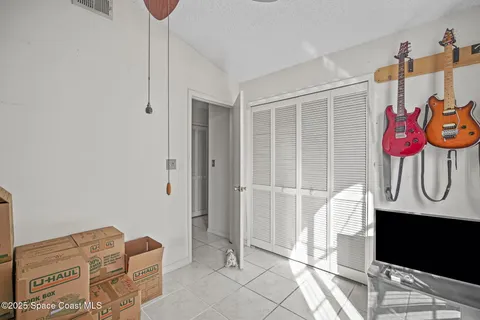 a living room with lots of furniture and gym equipment
