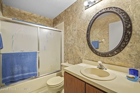 a bedroom with furniture and window