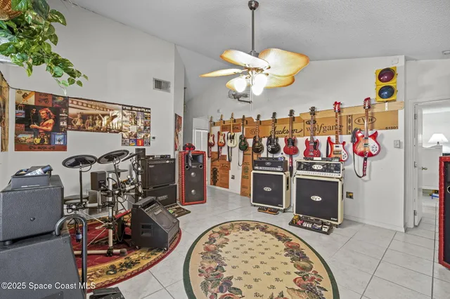 a view of a livingroom with dining room and chandelier