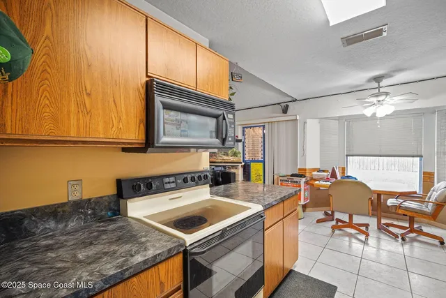 a living room with lots of furniture and a chandelier